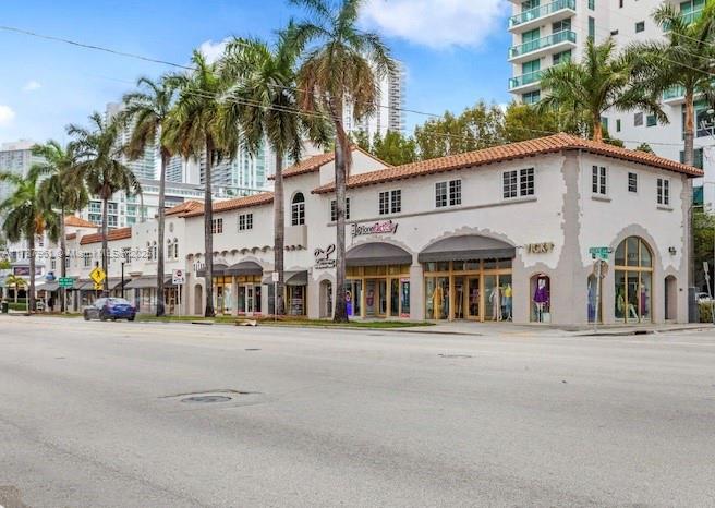 2411 Biscayne Boulevard, Unit 2 Miami, FL 33137 - Photo 25 of 25 a couple of palm trees in front of a building