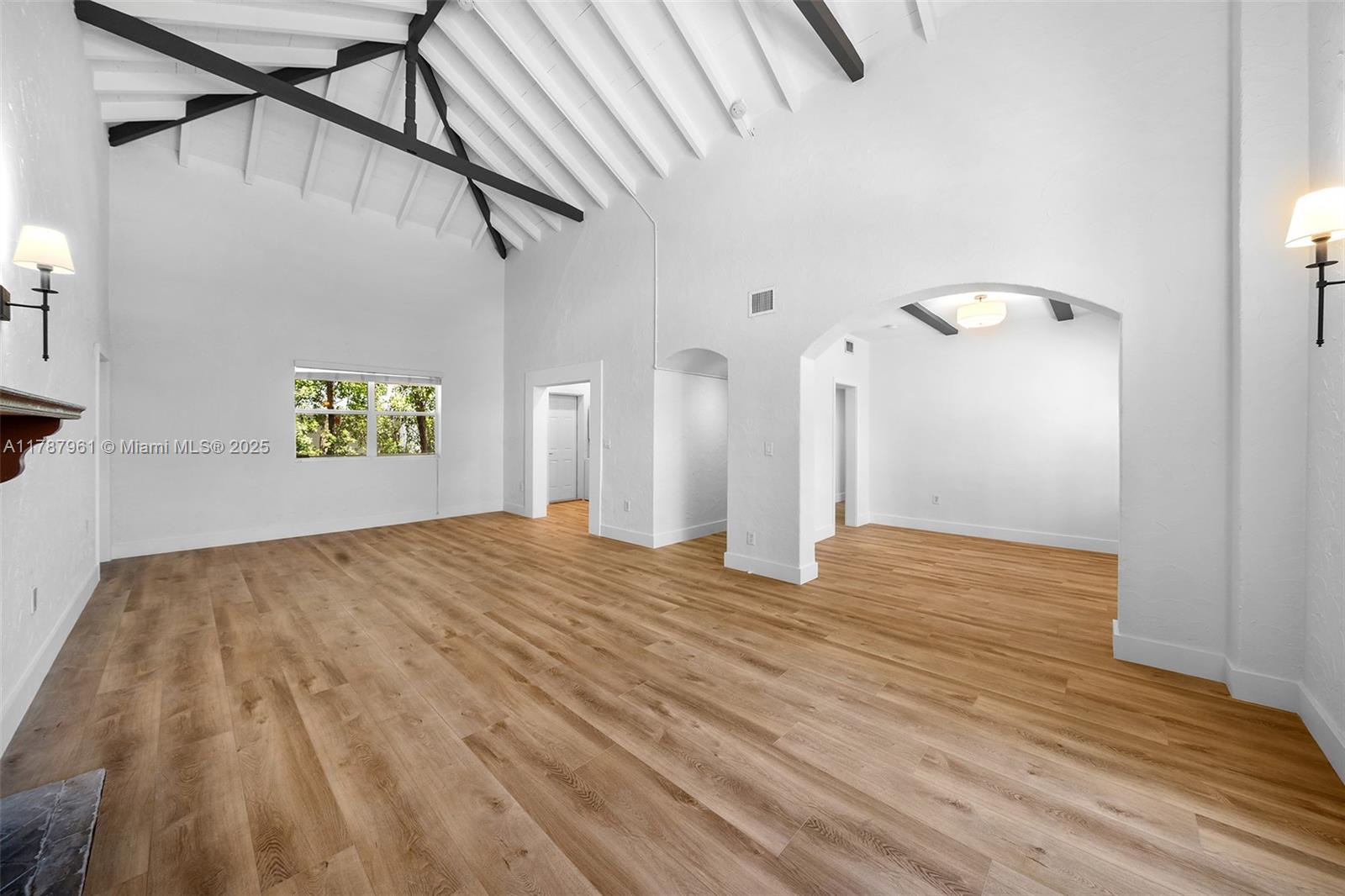 2411 Biscayne Boulevard, Unit 2 Miami, FL 33137 - Photo 8 of 25 a view of empty room with wooden floor