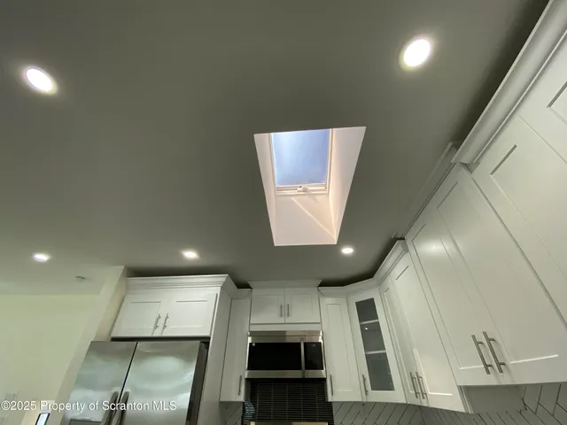 a view of an empty room with stairs