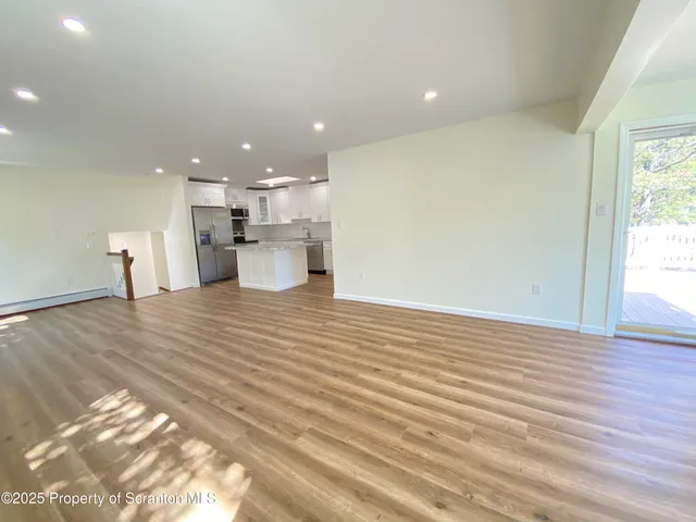 a view of a kitchen and a window