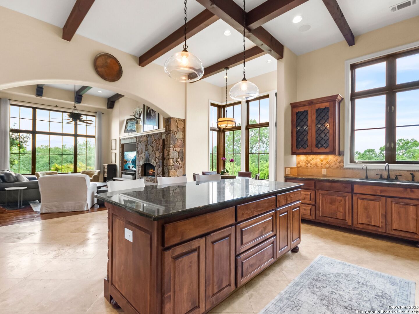 103 Castle Rock Boerne, TX 78006 - Photo 20 of 99 a kitchen with stainless steel appliances granite countertop a sink and a large window