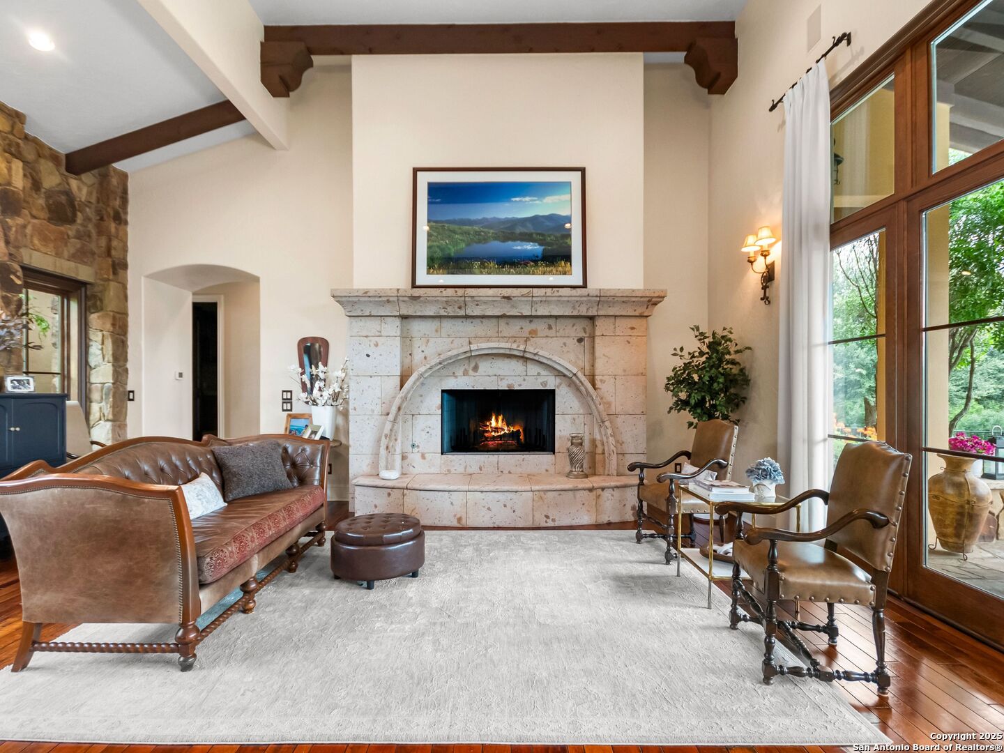 103 Castle Rock Boerne, TX 78006 - Photo 23 of 99 a living room with furniture and a fireplace