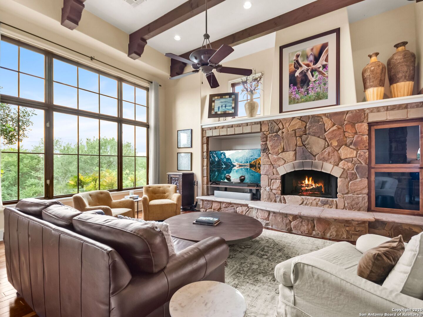 103 Castle Rock Boerne, TX 78006 - Photo 26 of 99 a living room with furniture large window and a fireplace
