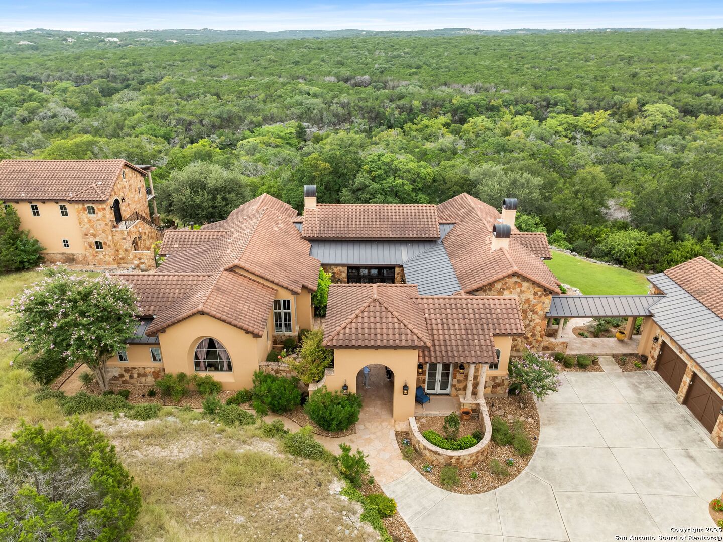 103 Castle Rock Boerne, TX 78006 - Photo 4 of 99 an aerial view of a house with yard and mountain view in back