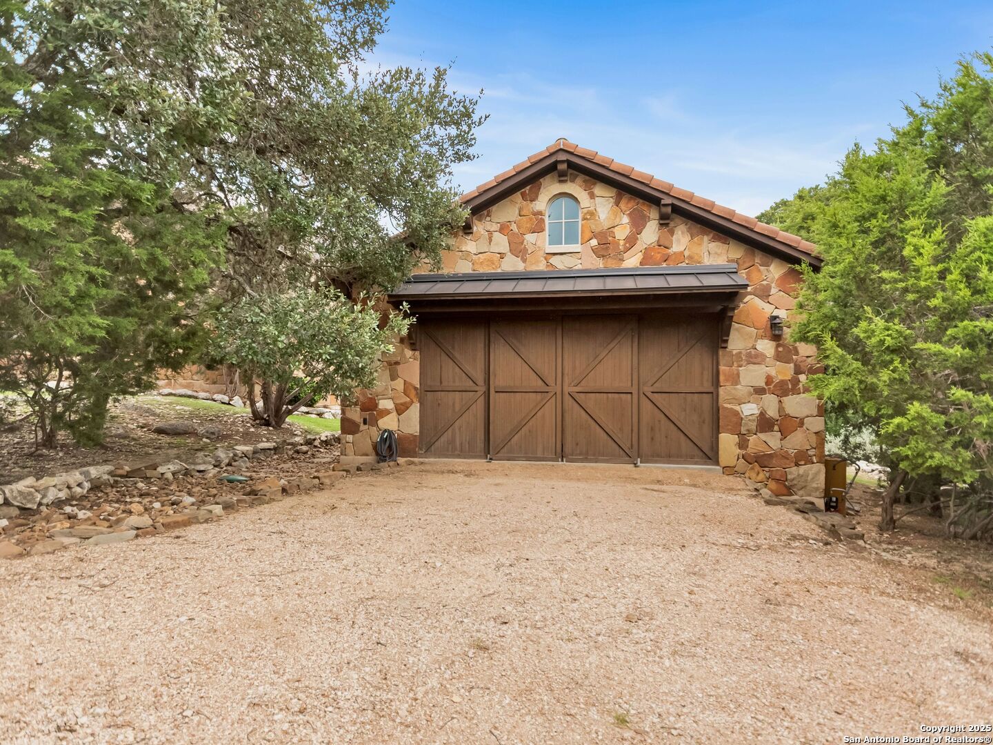 103 Castle Rock Boerne, TX 78006 - Photo 47 of 99 a front view of a house with a yard and garage