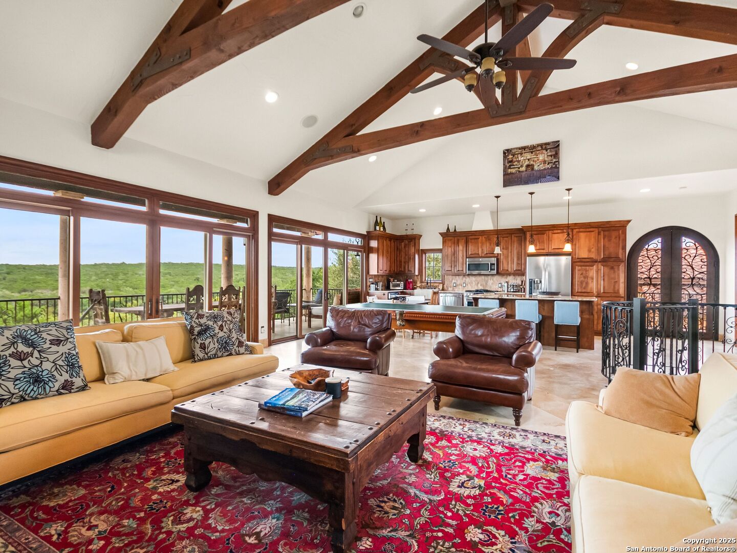 103 Castle Rock Boerne, TX 78006 - Photo 73 of 99 a living room with furniture a rug and a floor to ceiling window