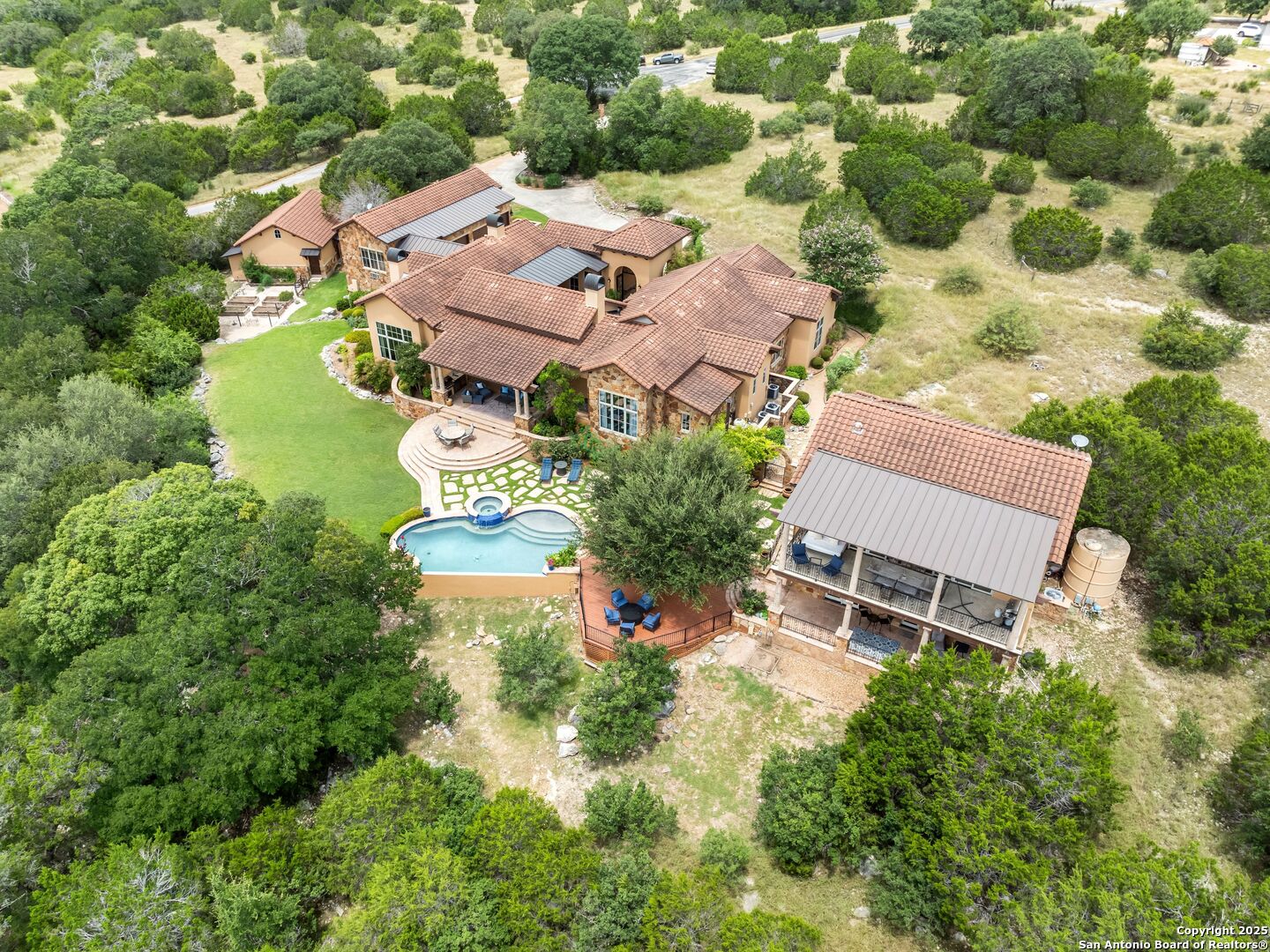 103 Castle Rock Boerne, TX 78006 - Photo 91 of 99 an aerial view of a house with swimming pool and outdoor space