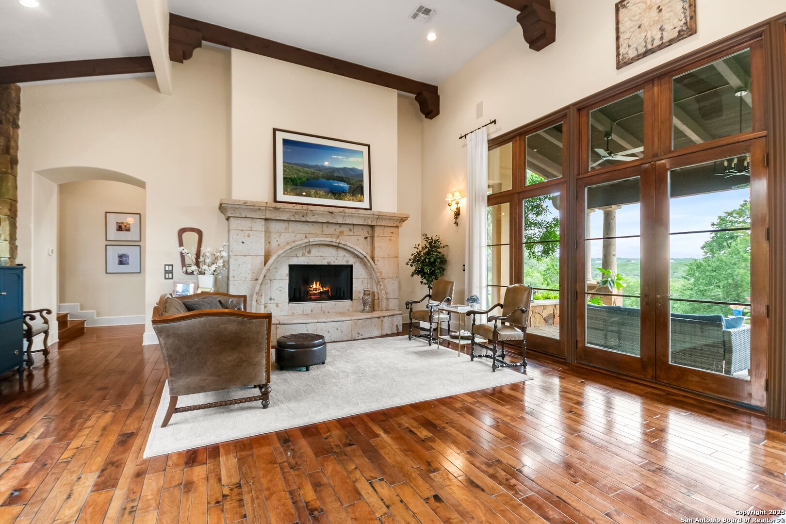 103 Castle Rock Boerne, TX 78006 - Photo 96 of 99 a living room with furniture large window and a fireplace
