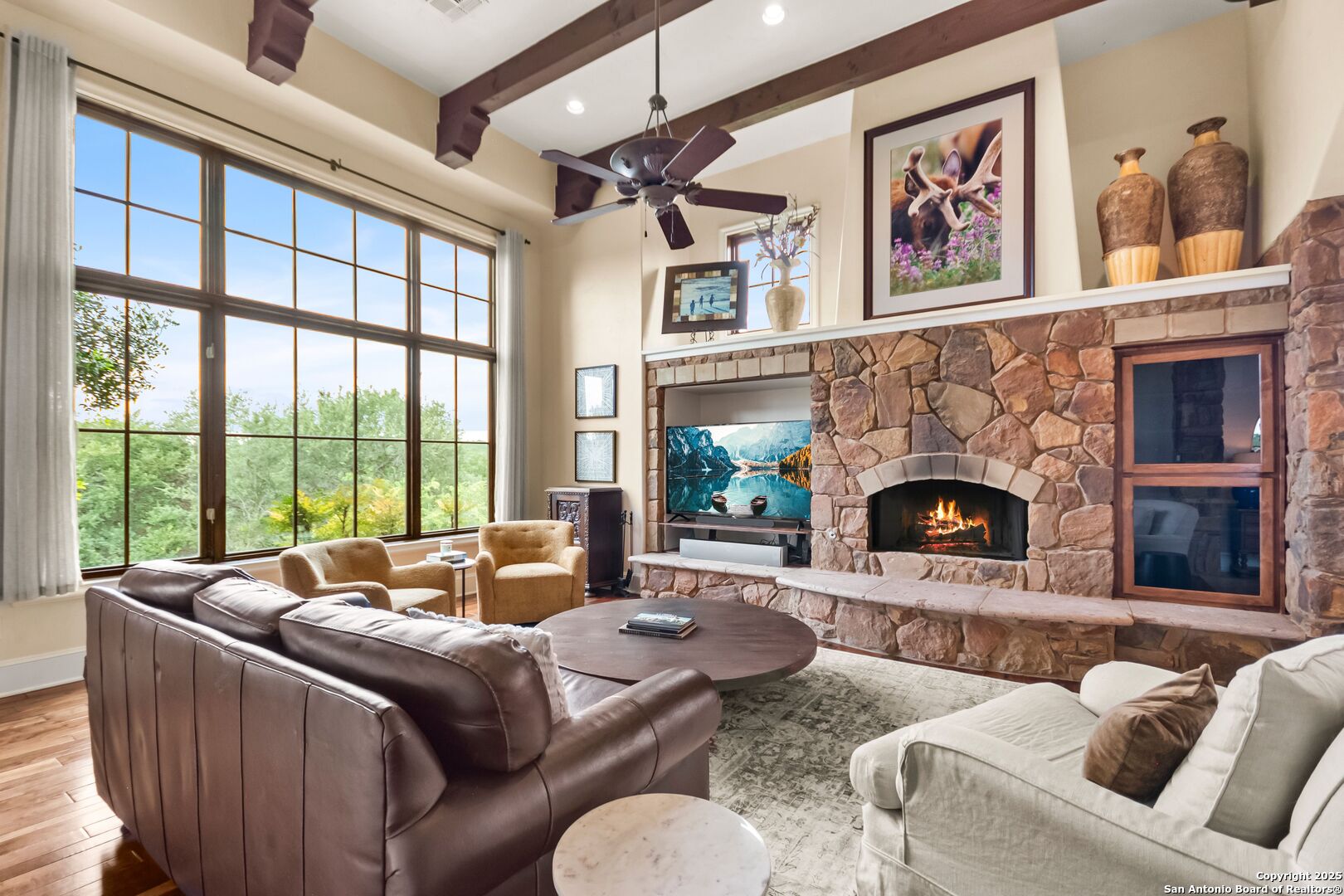 103 Castle Rock Boerne, TX 78006 - Photo 97 of 99 a living room with furniture large window and a fireplace