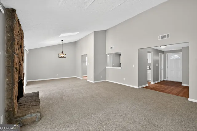 a view of an empty room and window