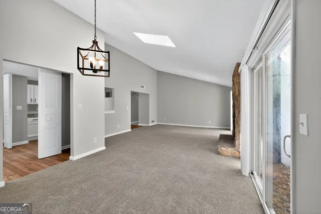 a view of a hallway with a livingroom