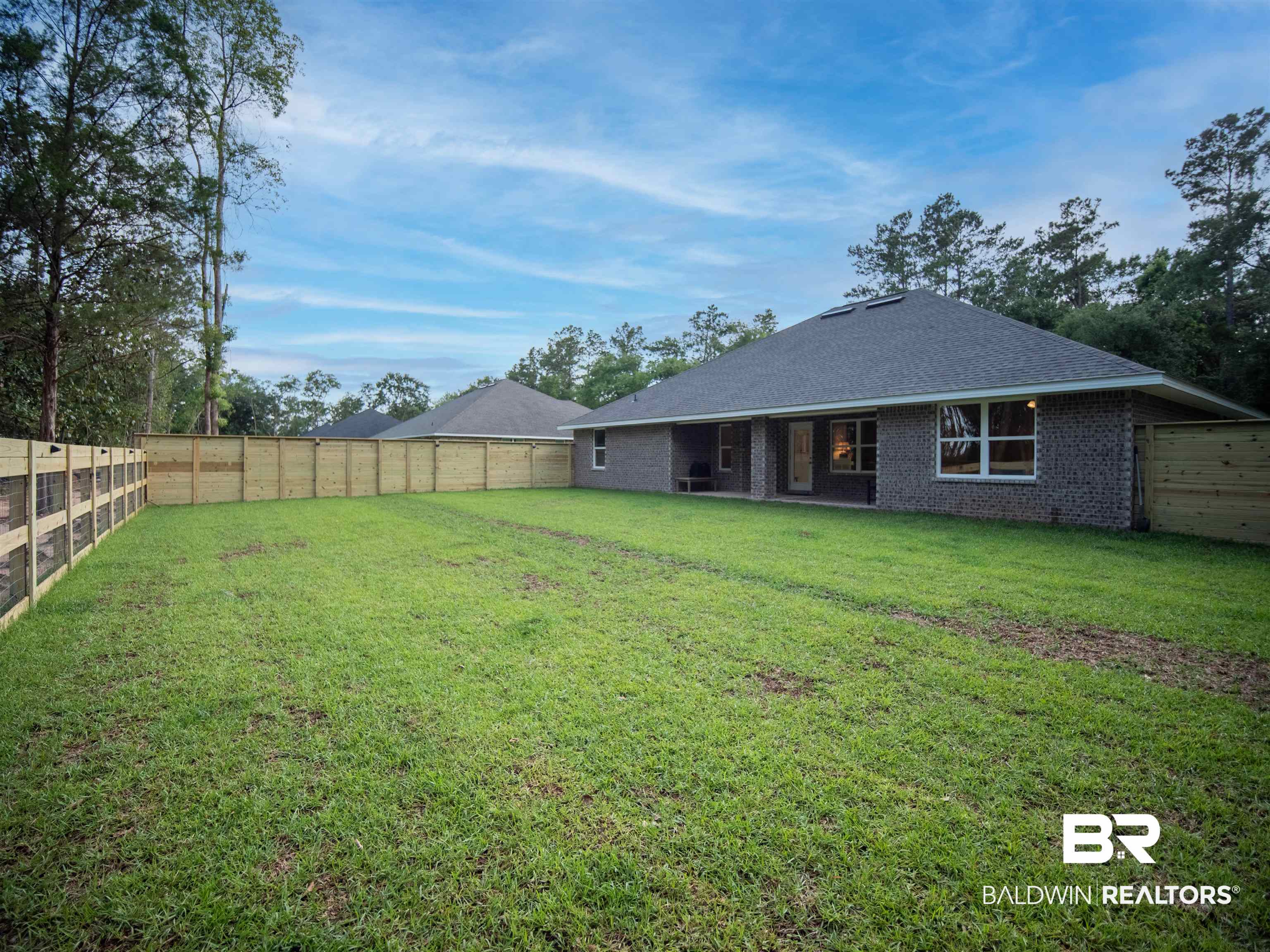12646 Michigan Avenue Elberta, AL 36530 - Photo 40 of 47 Back of house featuring a fenced backyard and brick siding