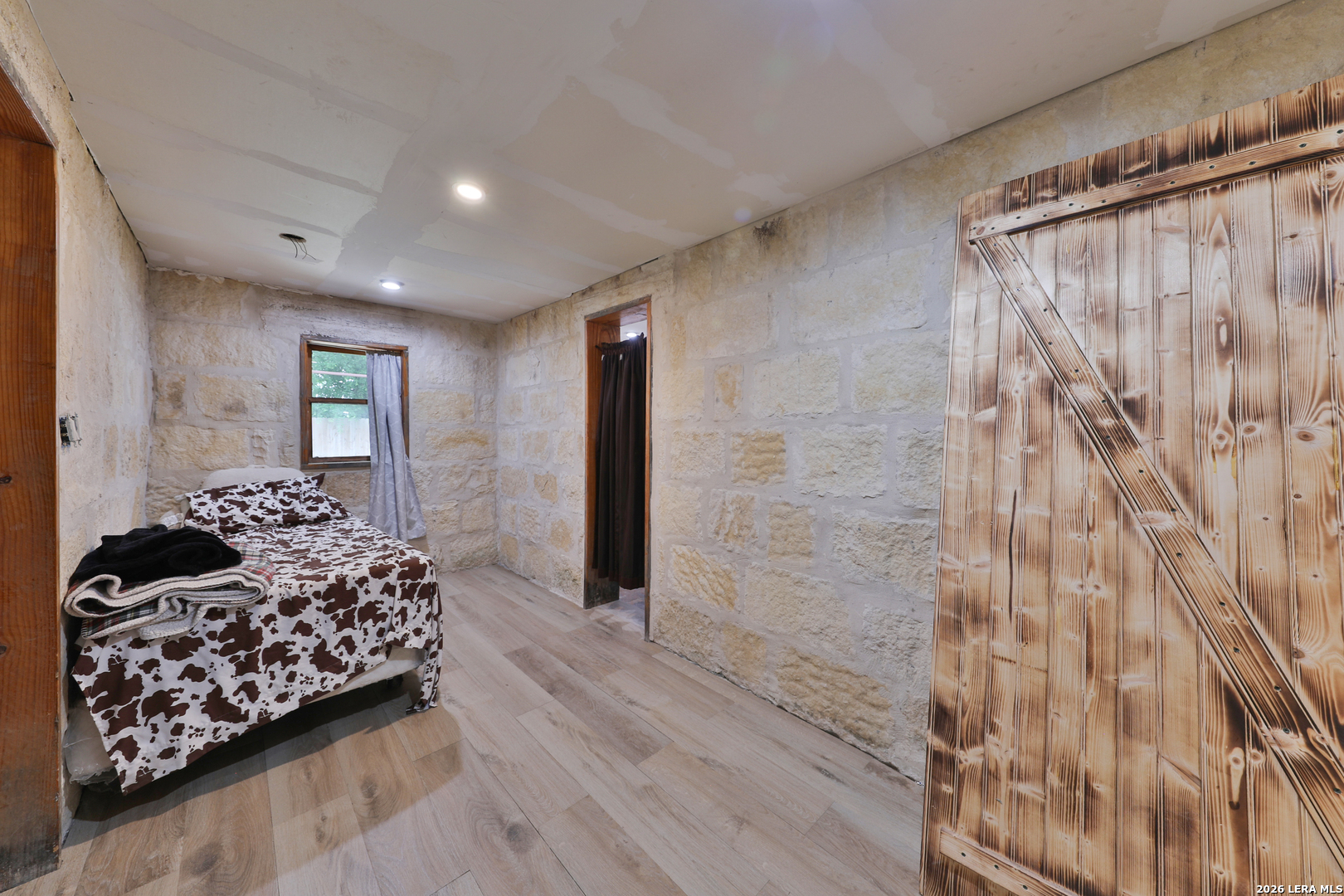 122 Brink Center Point, TX 78010 - Photo 10 of 40 a bedroom with a bed and a couch