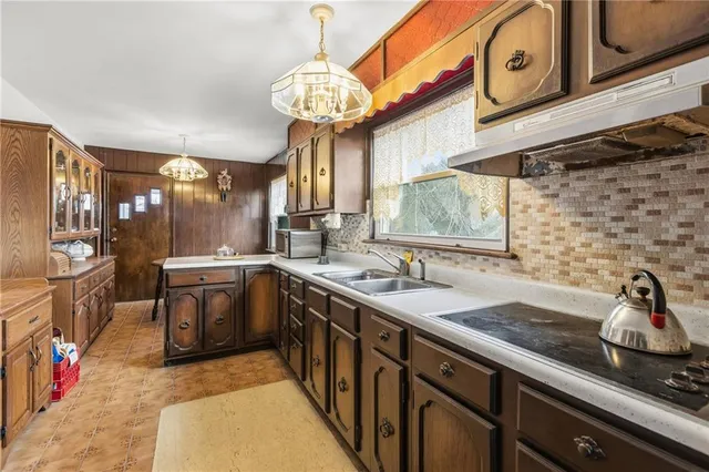 a kitchen with stainless steel appliances granite countertop a sink and cabinets
