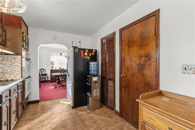 a view of a livingroom with furniture window and wooden floor