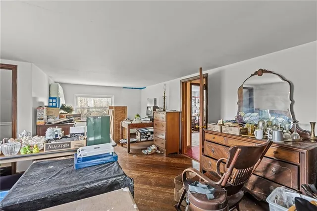 a view of a livingroom with furniture and a window