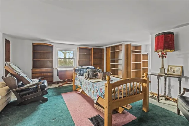 a living room with furniture a couch and a window