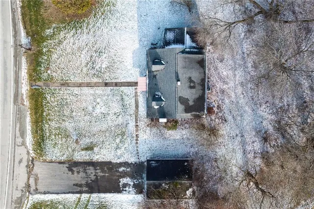 a view of a yard with large trees