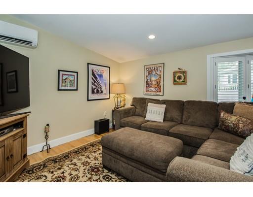 52 Harland Road Waltham, MA 02453 - Photo 11 of 37 a living room with furniture and a flat screen tv