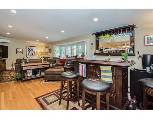 52 Harland Road Waltham, MA 02453 - Photo 15 of 37 a kitchen with stainless steel appliances a table and chairs in it