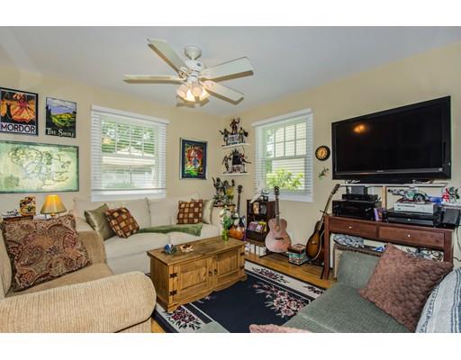 52 Harland Road Waltham, MA 02453 - Photo 19 of 37 a living room with furniture and a flat screen tv