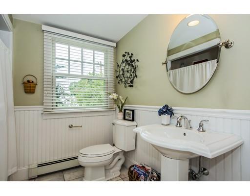52 Harland Road Waltham, MA 02453 - Photo 20 of 37 a bathroom with a toilet a sink and mirror