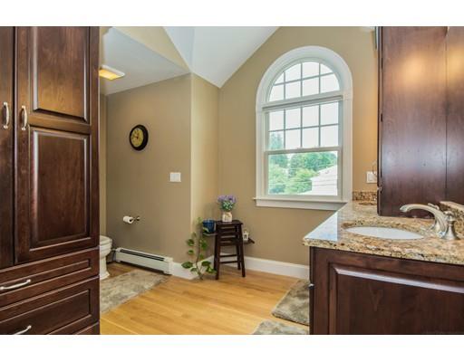 52 Harland Road Waltham, MA 02453 - Photo 27 of 37 a living room with a dresser and a window