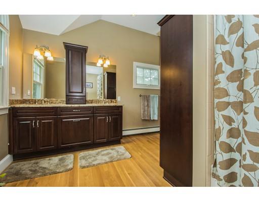 52 Harland Road Waltham, MA 02453 - Photo 28 of 37 a bathroom with a sink a mirror and a bathtub