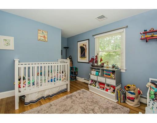52 Harland Road Waltham, MA 02453 - Photo 29 of 37 a bedroom with furniture and a bed