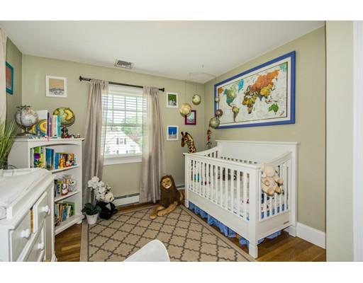 52 Harland Road Waltham, MA 02453 - Photo 33 of 37 a view of a bedroom with furniture and windows