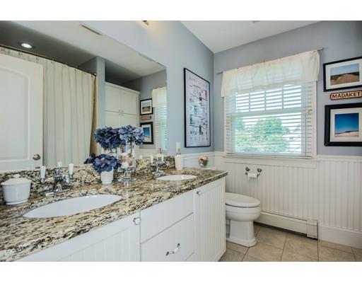 52 Harland Road Waltham, MA 02453 - Photo 34 of 37 a bathroom with a granite countertop sink mirror and a bathtub