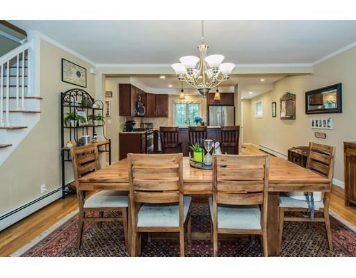 52 Harland Road Waltham, MA 02453 - Photo 8 of 37 a view of a dining room with furniture and chandelier