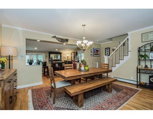 52 Harland Road Waltham, MA 02453 - Photo 10 of 37 a living room with furniture and a chandelier