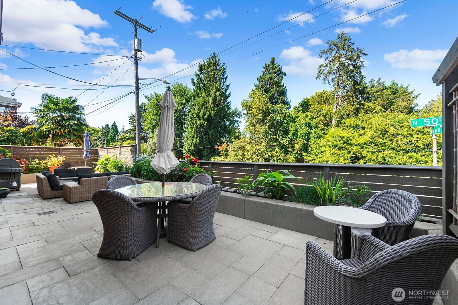 4915 Linden Avenue North, Unit 1 Seattle, WA 98103 - Photo 15 of 18 a roof deck with table and chairs
