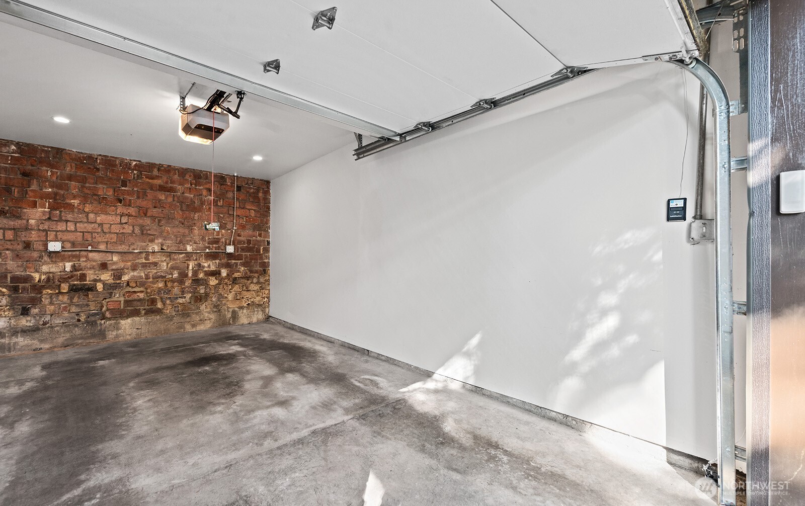 4915 Linden Avenue North, Unit 1 Seattle, WA 98103 - Photo 18 of 18 a view of a big room with wooden floor