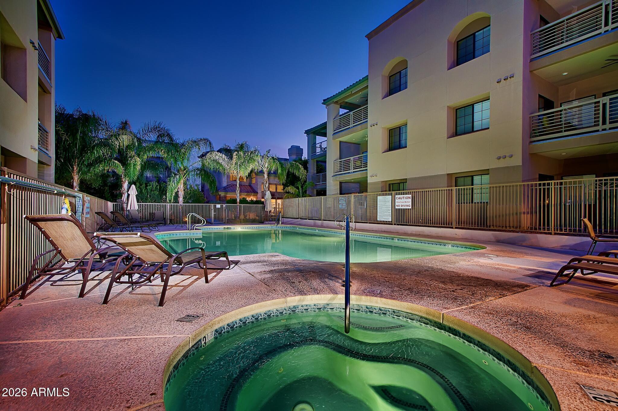 7609 East Indian Bend Road, Unit 3002 Scottsdale, AZ 85250 - Photo 18 of 19 a view of a backyard with a table and chairs