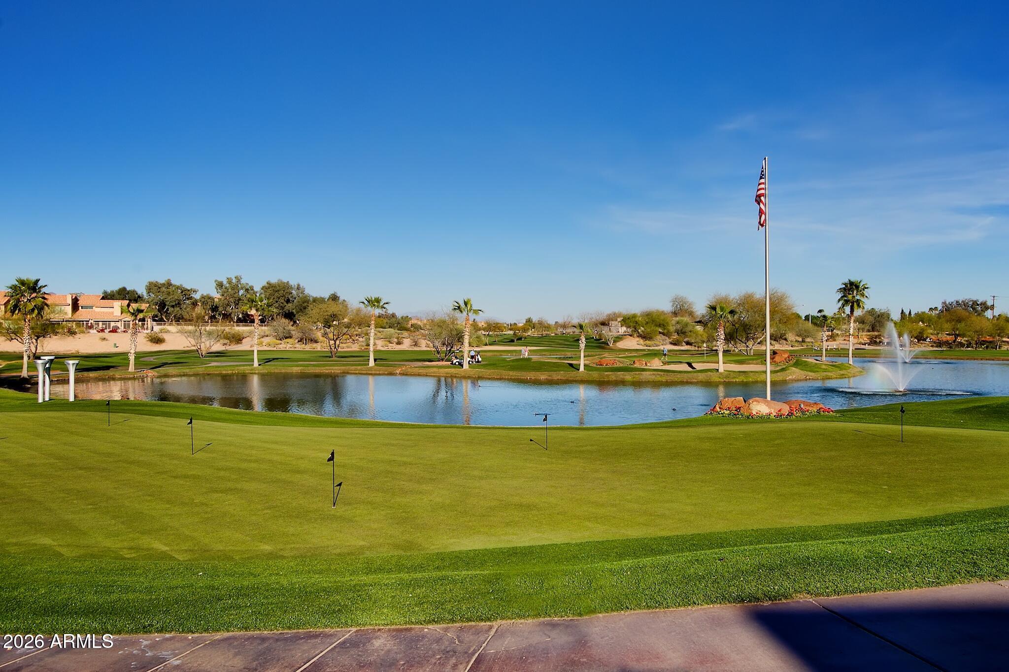 7609 East Indian Bend Road, Unit 3002 Scottsdale, AZ 85250 - Photo 3 of 19 a view of a lake with a big yard