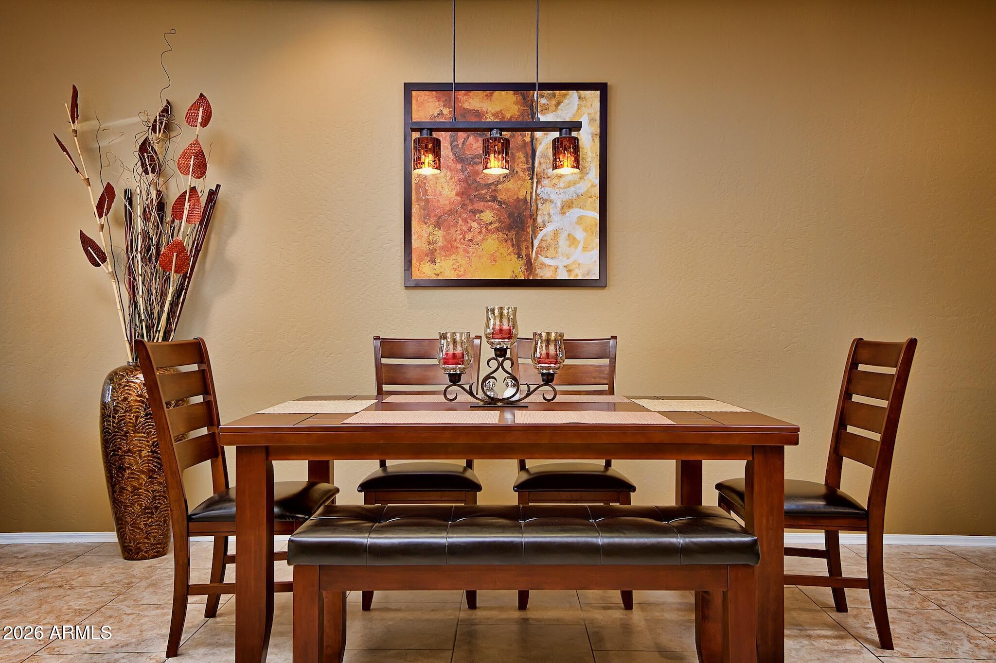 7609 East Indian Bend Road, Unit 3002 Scottsdale, AZ 85250 - Photo 5 of 19 a view of a dining room with furniture and wooden floor