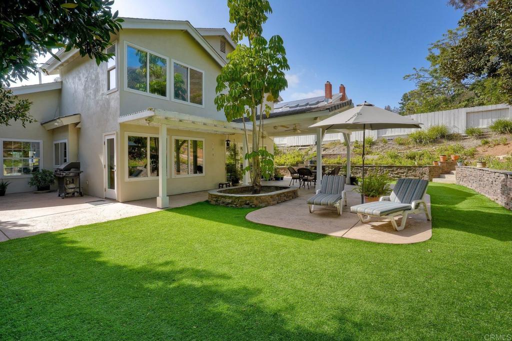 13639 Freeport Road San Diego, CA 92129 - Photo 26 of 44 a view of a house with backyard and porch