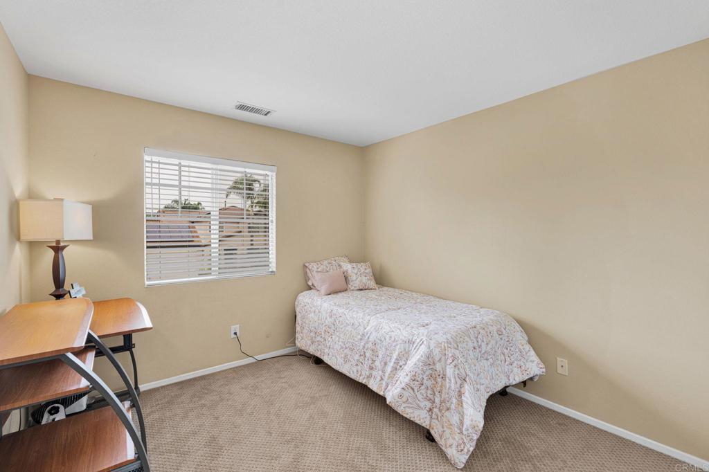 17866 Robusta Drive Riverside, CA 92503 - Photo 35 of 59 a bedroom with a bed and a window
