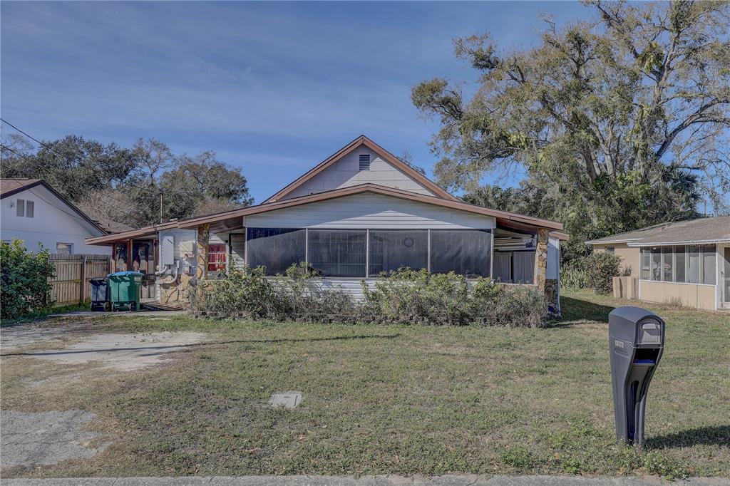 13172 Clay Avenue Largo, FL 33773 - Photo 1 of 30 a front view of a house with garden
