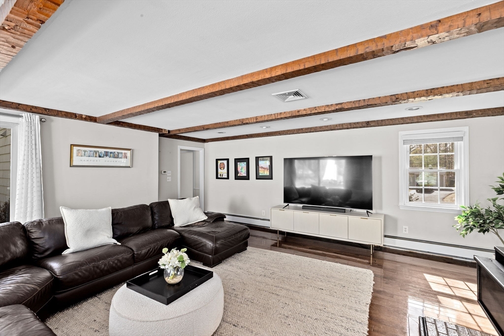 47 Deborah Road Hanover, MA 02339 - Photo 6 of 22 a living room with furniture and a flat screen tv