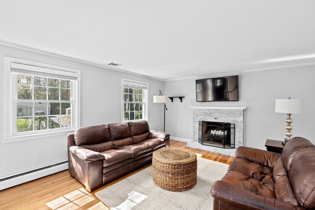 47 Deborah Road Hanover, MA 02339 - Photo 8 of 22 a living room with furniture and a fireplace