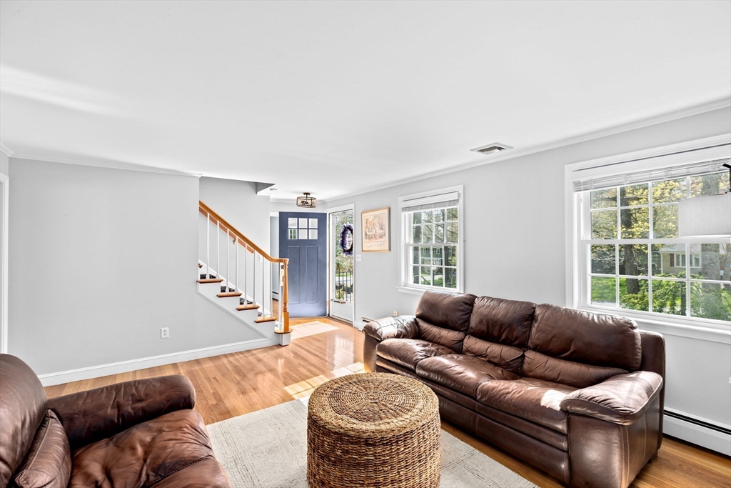 47 Deborah Road Hanover, MA 02339 - Photo 9 of 22 a living room with furniture and a large window