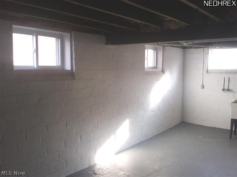 3642 Bainbridge Road Cleveland Heights, OH 44118 - Photo 22 of 25 Clean crisp basement w rear higher than average ceiling hieght allows for a "true" walk-able finished! Also new insulated vynal sliding style windows w screens.