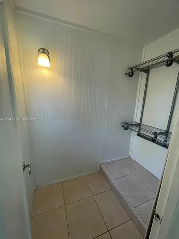 a bathroom with a granite countertop shower and a sink