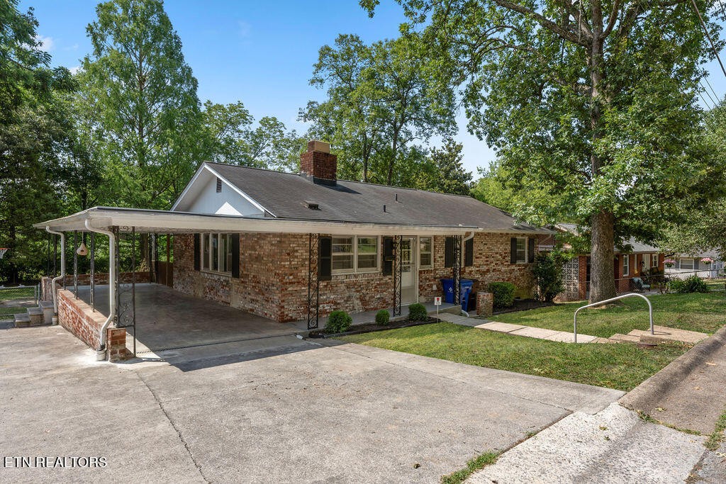 114 Tucker Road Oak Ridge, TN 37830 - Photo 17 of 22 a front view of a house with garden