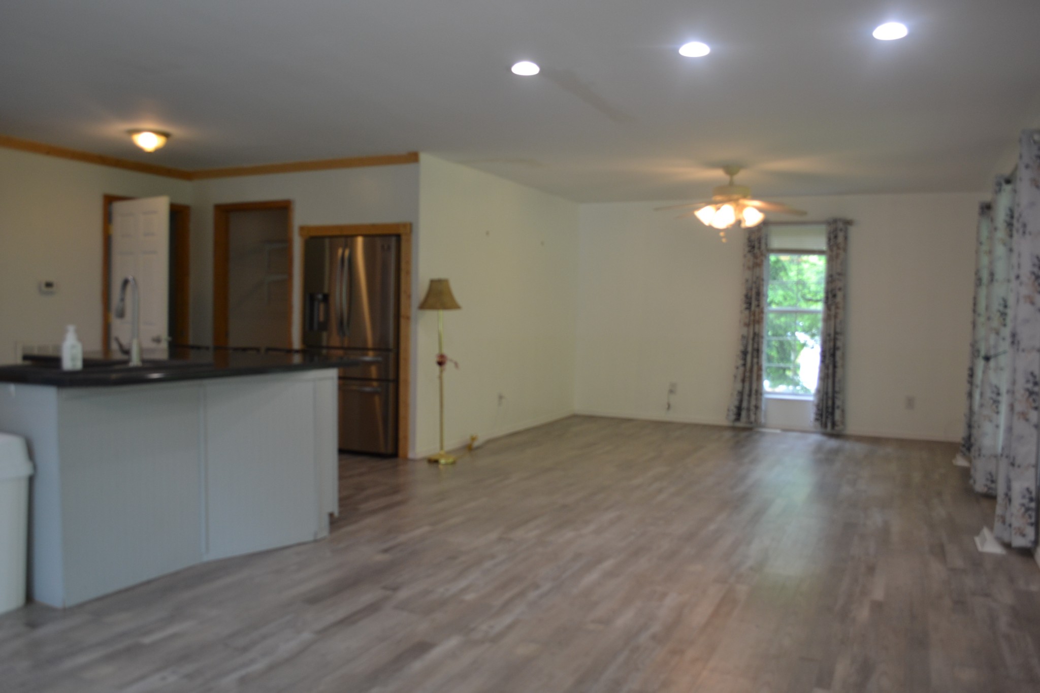 1505 Add Stafford Road Hilham, TN 38568 - Photo 4 of 65 an empty room with wooden floor and windows