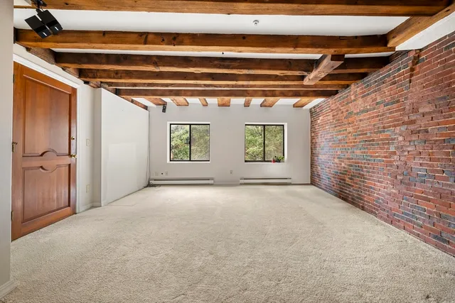 a view of an empty room with a windows