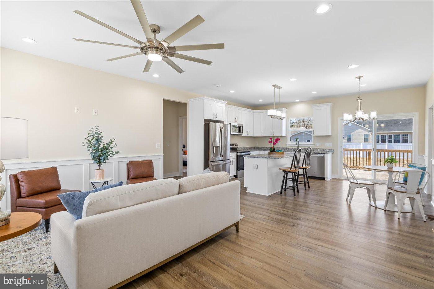 1419 South Glebe Road Montross, VA 22520 - Photo 30 of 76 a living room with furniture kitchen view and a chandelier